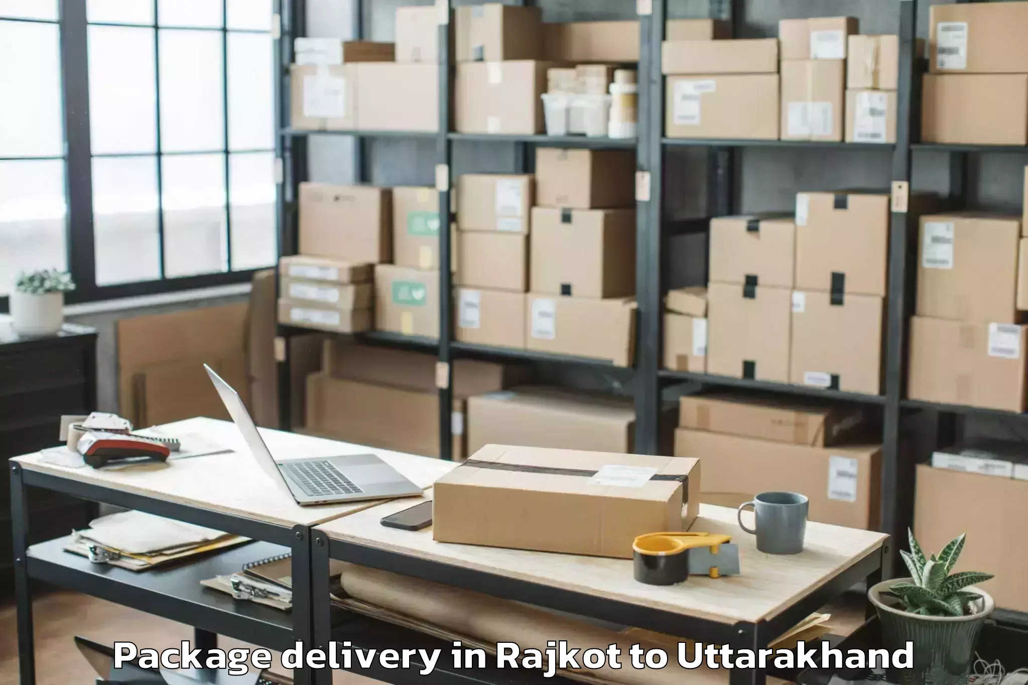 Hassle-Free Rajkot to Dhoomakot Package Delivery